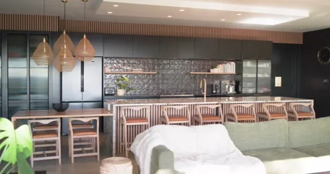 Camera is panning right, triggered by slider, revealing open-plan living kitchen Video stock 336844848