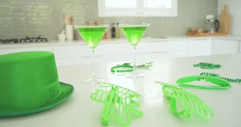 Camera is panning right on white counter, centering martini glasses and moving Vídeo Stock 340974033