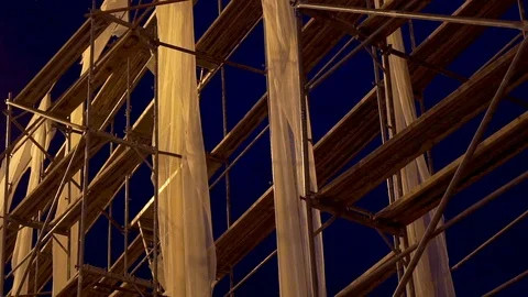 Camera panning on scaffold construction.  Night scene Artificial lighting Stock Footage 91711773
