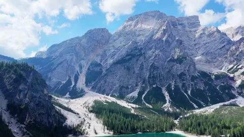 Camera panning showing beautiful mountain lake surrounded by forest Stock Footage 283296504