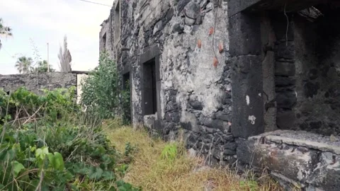 Camera panning showing old abandoned stone house Stock Footage 293159195