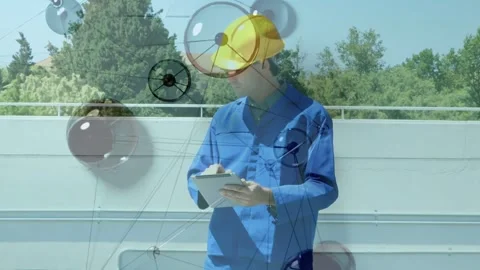Camera panning up, solar tech tapping tablet and inspecting array with node Stock-Footage 333893978