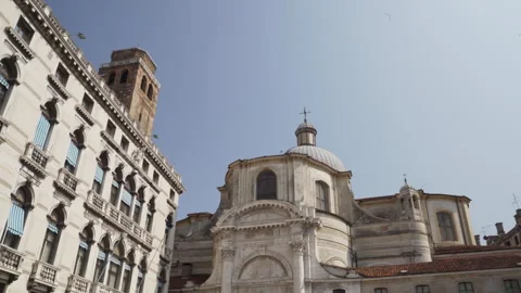 Camera panning upwards showing classic italian architecture in venice Stock Footage 293846197