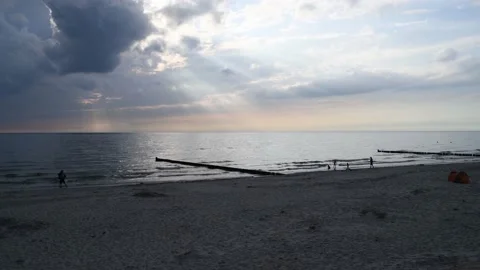 Camera panning, waves rinse to the beach on the baltic sea Video stock 142213701