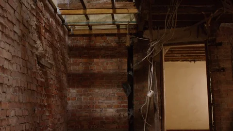 Camera pans across an abandoned and dilapidated building Stock-Footage 111196223