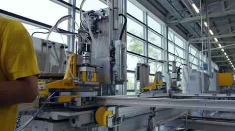 Camera pans across to create a Portrait of factory worker Stock Footage 63020009