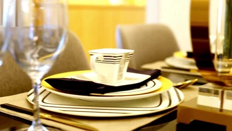 Camera pans across elegantly set dinner table with glassware Vídeo Stock 333815644