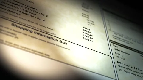 Camera pans across a Generic Gas Bill - Very Large Bill 2 Stock Footage 307731362