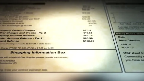 Camera pans across a Generic Gas Bill Stock Footage 307731373