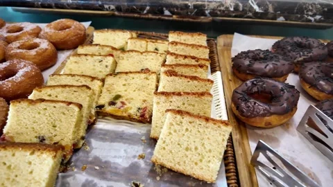Camera pans across hotel buffet breakfast table with various pastries and s.. Stock Footage 333153282