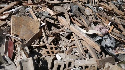 Camera Pans Across a Pile of Rubble of Demolished Building 3 Stock Footage 318763593