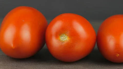 Camera pans across red plum tomatoes Video stock 65727766