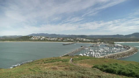 Camera pans across a view of a beautiful harbour with oceans and mountains Stock Footage 231275776
