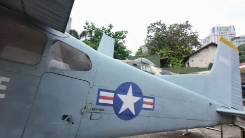 Camera pans along Cessna US military plane at War Remnants Museum, Ho Chi Minh Stock Footage 307833638