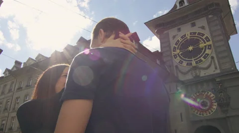 Camera pans around couple as they kiss while in the city. Stock Footage 63008367