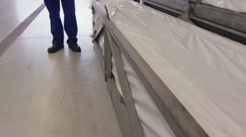 Camera pans around factory worked using a tablet while at work Stock Footage 63020186