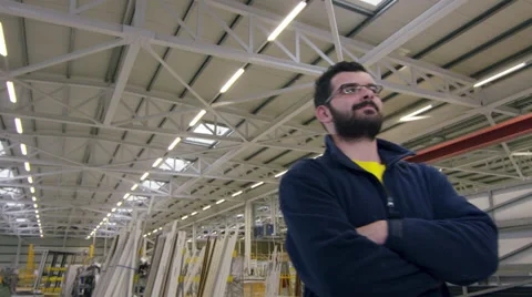 Camera pans around staff member in a factory Stock Footage 63028956