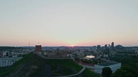 The camera pans up from below with a view of Gediminas Tower and the center of V Vidéo 248860823
