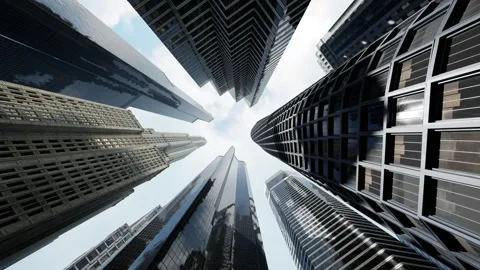 The camera pans from bottom to top in the middle of a business district in the Stock Footage 255625744