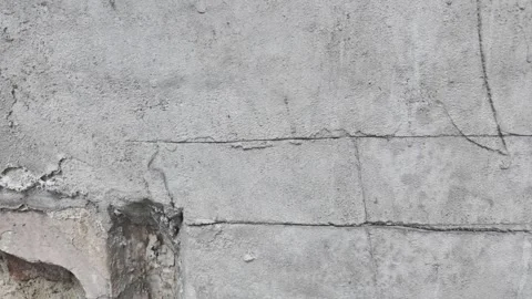 The camera pans diagonally from a damaged brick niche Stock Footage 338405203