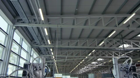 Camera pans down to create a Portrait of factory worker Stock Footage 63024782