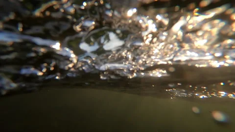 Camera pans down to the river. Underwater view. Fast movement Stock Footage 141830415