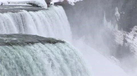 The camera pans from the edge of the Falls downward Stock Footage