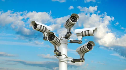 The camera pans five security cameras attached to a pole. Stock Footage 68316339