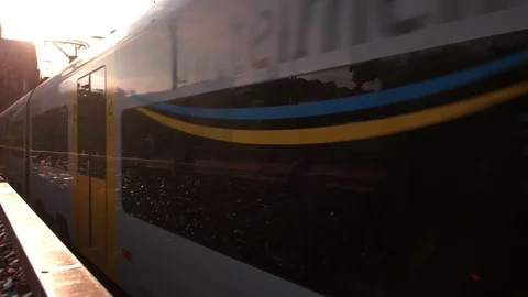 Camera pans with an Intercity train departing Cologne Stock Footage 90849555