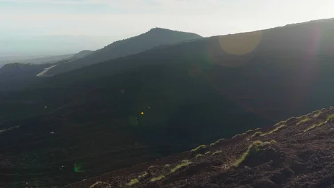 Camera pans left to reveal the view from Mount Etna Stock Footage 88597666