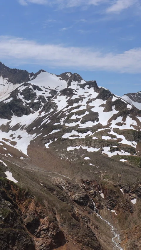 Camera Pans From Left To Right Revealing A Majestic Mountain Range With Snow-Cap Video stock 319208397