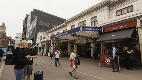 Camera pans from the old Farringdon Station to the new station entrance 스톡 동영상 93859801