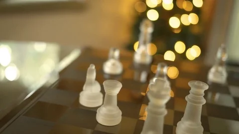 Camera pans over cinematic chess match with bokeh Stock Footage