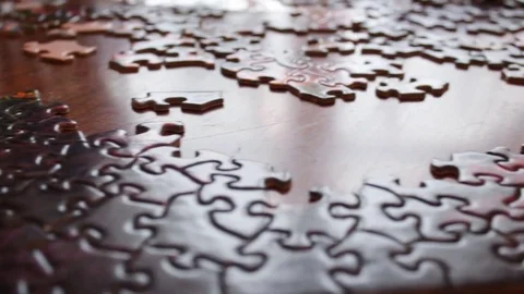 Camera Pans over complicated crazy unfinished puzzle Stock Footage 71964724