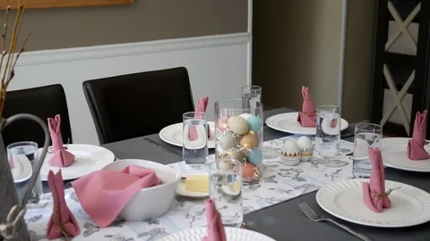 Camera pans over Easter Dinner table decorated Stock Footage 88065978