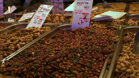 Camera Pans Over Mixed Nuts And Dried Fruits On Display In Market Stock Footage 71572967