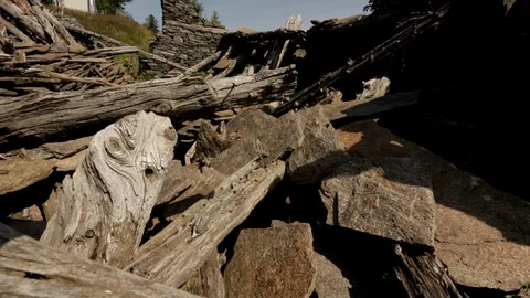 Camera pans over ruins of crumbled mountain house. Stock Footage 86756727