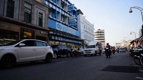 Camera Pans with Scooter Traffic on Soi Yaowarad, Phuket Town Stock Footage 85413098