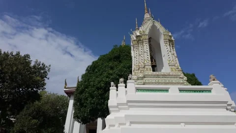 Camera pans up a small pagoda inside Wat Phra, Bangkok Stock Footage 303889832