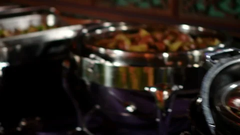 Camera pans on stainless steel server with potatoes and roasted carrots at b Stock Footage 124267256