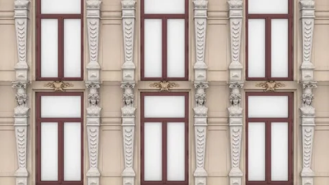 The camera pans upwards and shows the unusual facade of an old house with stucco Stock Footage 155179213