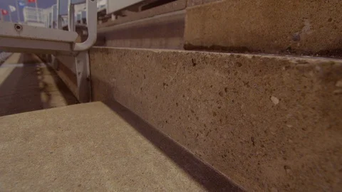 Camera pans upwards on the steps and reveals number 34 in Buffalo Stadium Video stock 102102195