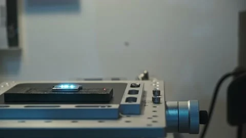 Camera passage in front of working platform of laser machine with object lying Stock-Footage 204036778