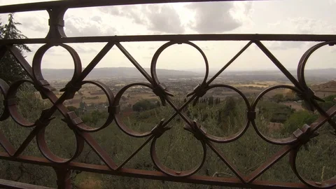 Camera passes in the middle of an iron railing, Assisi Stock Footage 82133261
