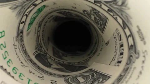 The camera passes through a bundle of dollar bills Stock Footage 288490446
