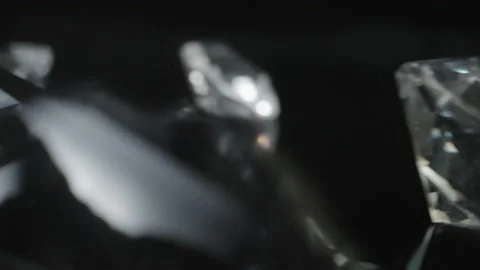 Camera passes through various shiny round shaped classic diamonds Stock Footage 225948723