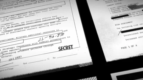 Camera passing over various top secret and classified documents and files. Top Stock Footage 327637453