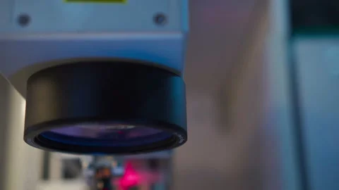 Camera passing by upper part of laser machine, including laser tube with mirror Stock Footage 204036681