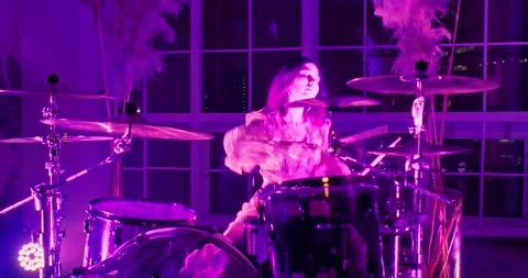 Camera peeks out from the corner and getting closer to the drummer playing drums Stock Footage 173448889