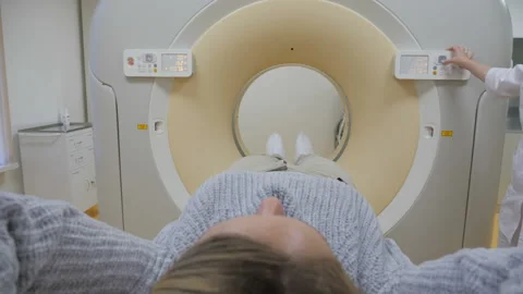 The camera is placed with the patient in a computerized tomography apparatus Stock Footage 97133839